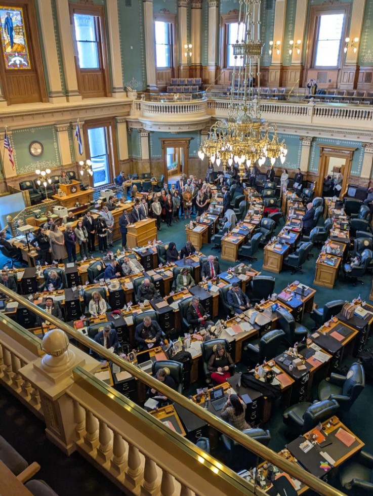 Colorado House chamber during floor debate, with House Republicans turned away from the podium.